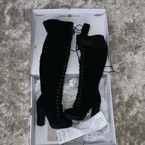 Over the knee lace up boots